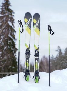 skis and ski poles on snow